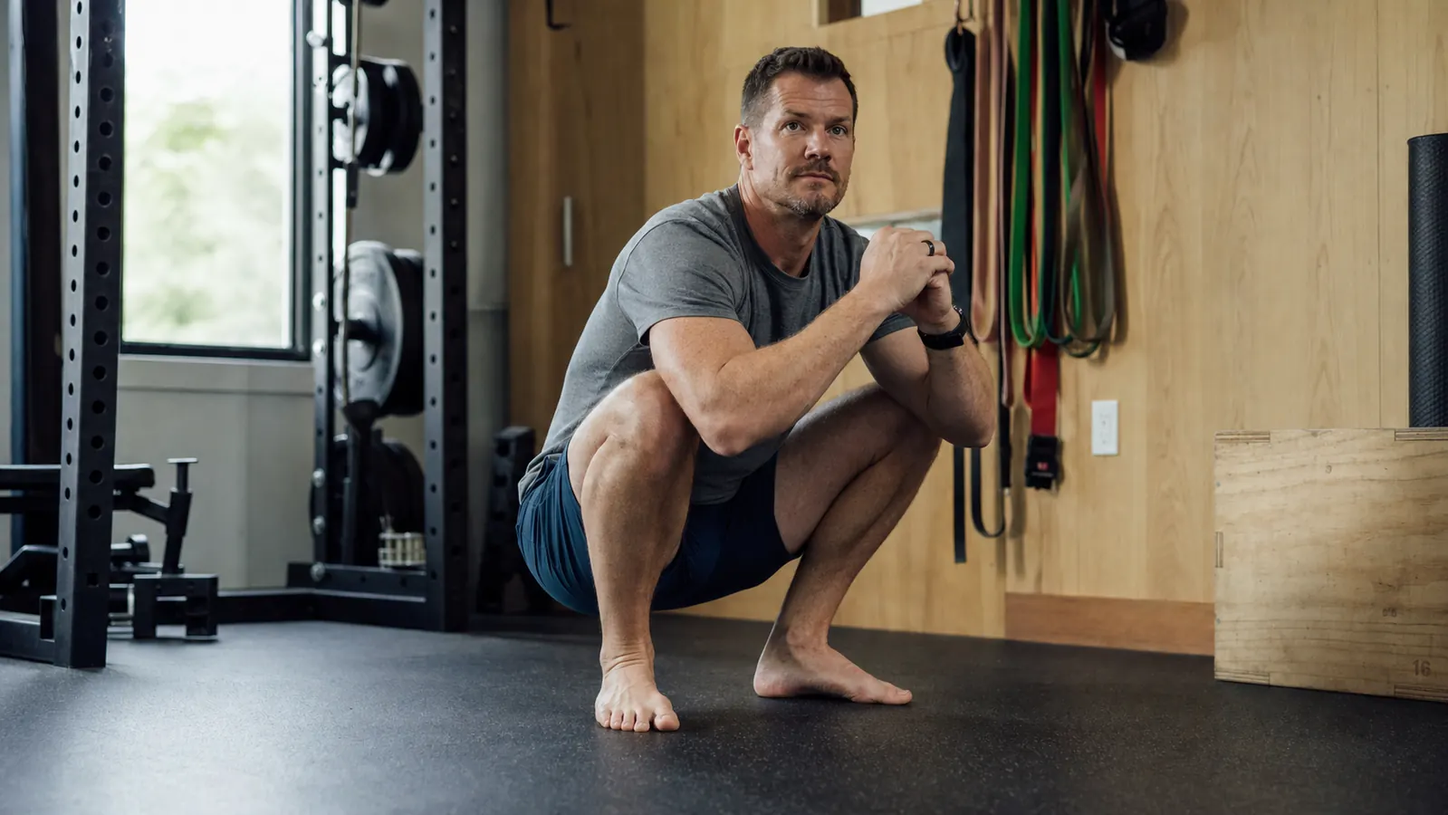 Man successfully completing a deadlift with clean hip position and no visible discomfort